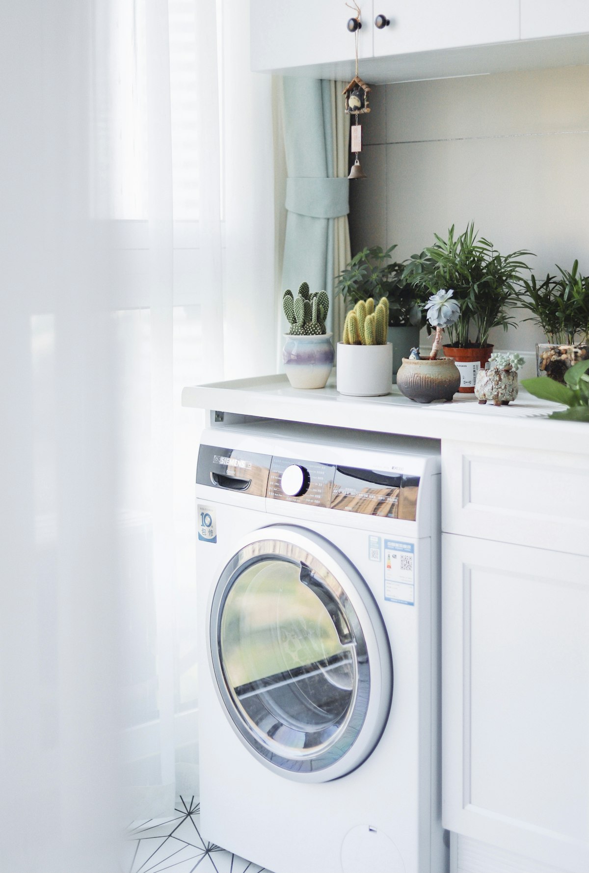 Washing machine in a laundry room ready for troubleshooting
